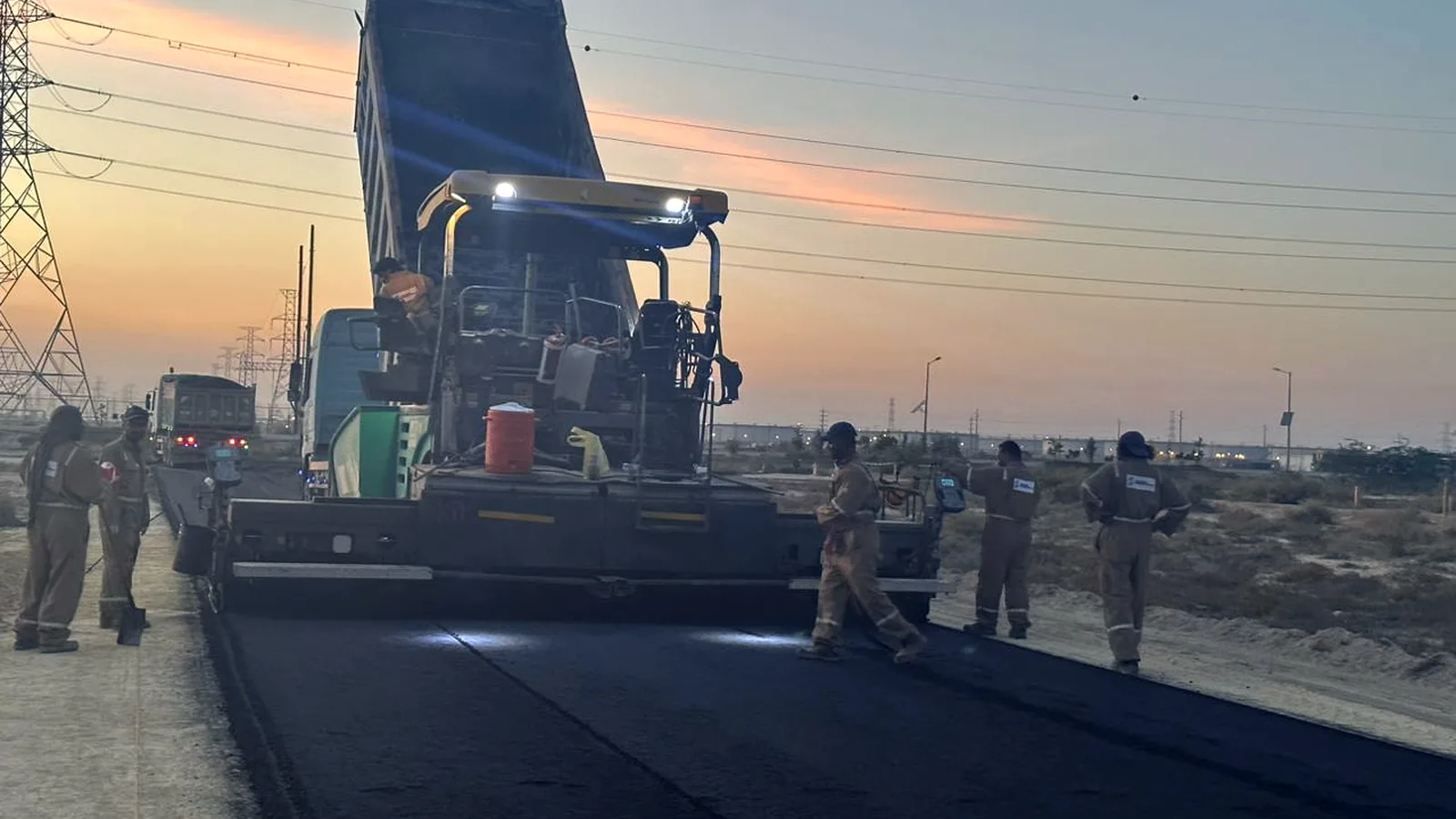 East Hope asphalt paving run at dusk in Ras Tanura
