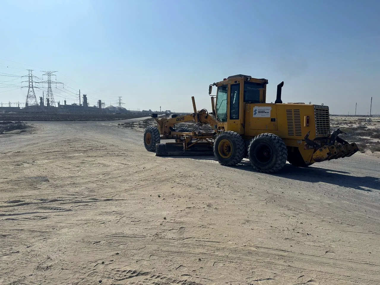 Motor grader cutting a new road alignment