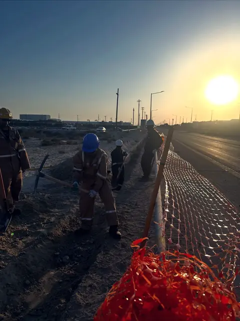 Excavation crew at last light